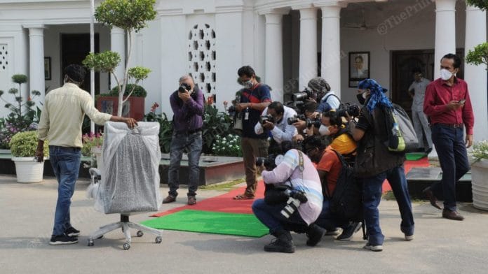 An empty chair is being photographed by journalists | Photo: Suraj Singh Bisht | ThePrint