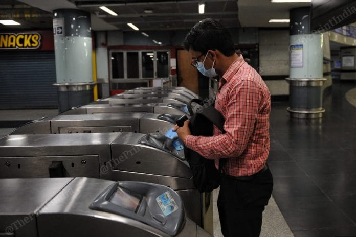 A passenger punches card at Huda City Centre metro station | Suraj Singh Bisht | ThePrint