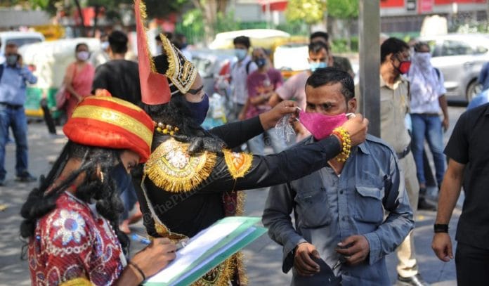 An employee of the Central Delhi district authorities patrols the roads dressed as Yamraj as part of Covid awareness campaign