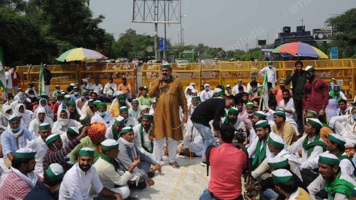 Farmers raise against the farm bills at the Delhi-Noida border Friday | Photo: Suraj Singh Bisht | ThePrint