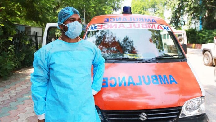 Ambulance driver Ansar Khan wearing a protective gown outside a mortuary in New Delhi. | Photo: Manisha Mondal/ThePrint