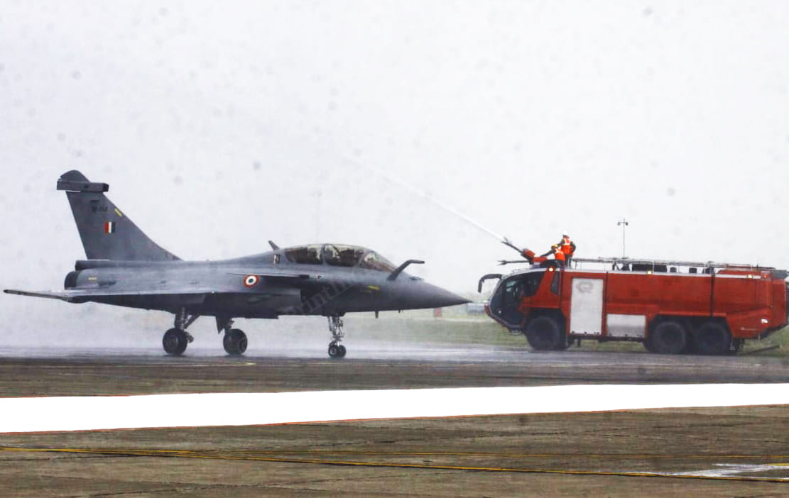 A fire brigade machine sprays water on the Rafale fighter jet | Photo: Praveen Jain | ThePrint