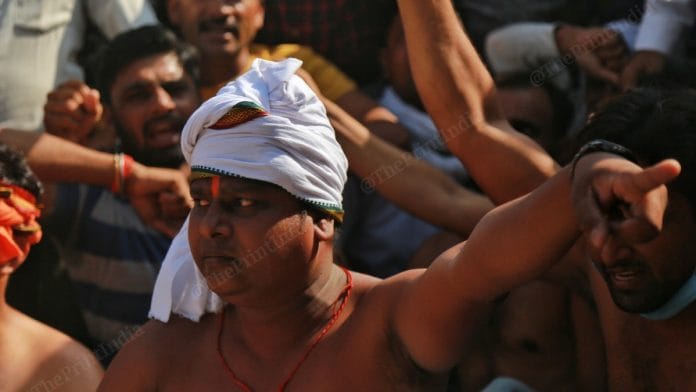 Members of 'Savarna Samaj' and Bajrang Dal agitate in Boolgarhi village in support of the Thakur men accused of the Hathras gang rape and murder case | Photo: Manisha Mondal | ThePrint