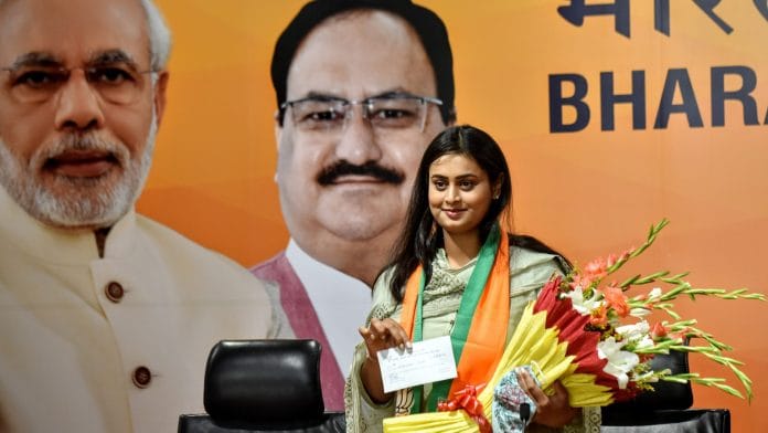 Shooter Shreyasi Singh, daughter of former union minister late Digvijay Singh, joins BJP in presence of party leader Bhupendra Yadav at BJP headquarters in New Delhi on Sunday. | ANI