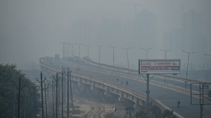 Vehicles ply on a street, amid hazy weather conditions, in Ghaziabad, Wednesday, 28 October, 2020 | PTI