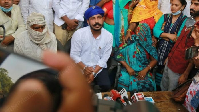 Bhim Army Chief Chandrashekar Azad with the family members of the Hathras woman Sunday | Manisha Mondal | ThePrint