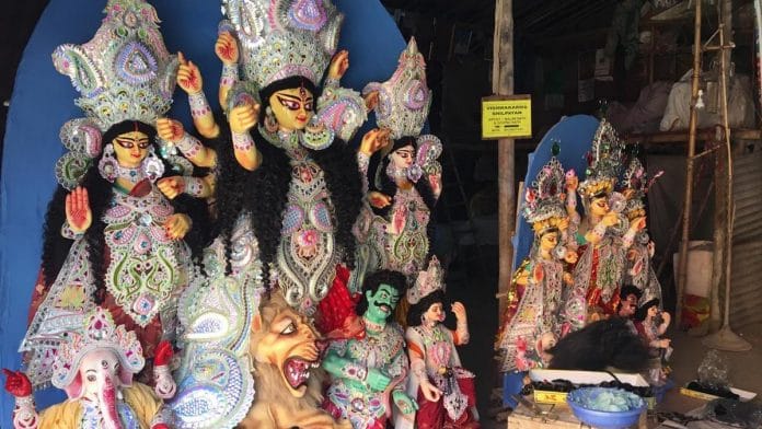 Idols get their finishing touches at C.R Park Kali Mandir | ThePrint Photo | Sravasti Dasgupta