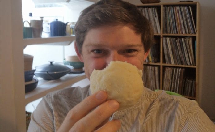 British lecturer Edward Anderson poses with an idli, in a photo he posted on his Twitter account | @edanderson101 | Twitter