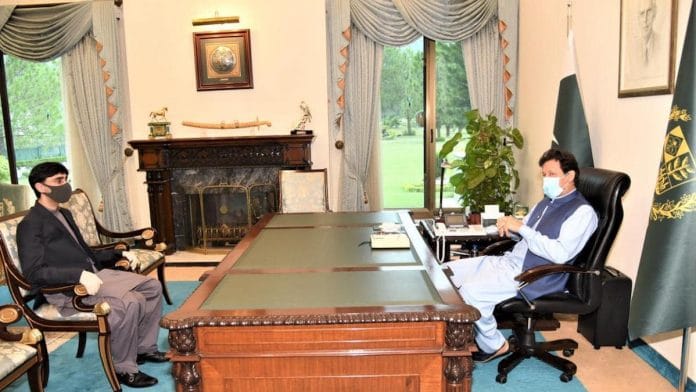 Moeed Yusuf with Pakistan Prime Minister Imran Khan | Facebook/ImranKhanOfficial