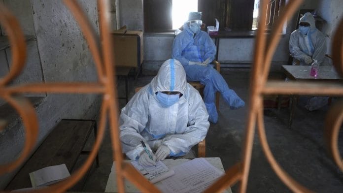 Health workers wearing PPE kits conduct Covid-19 Rapid Antigen test | Representational image | PTI