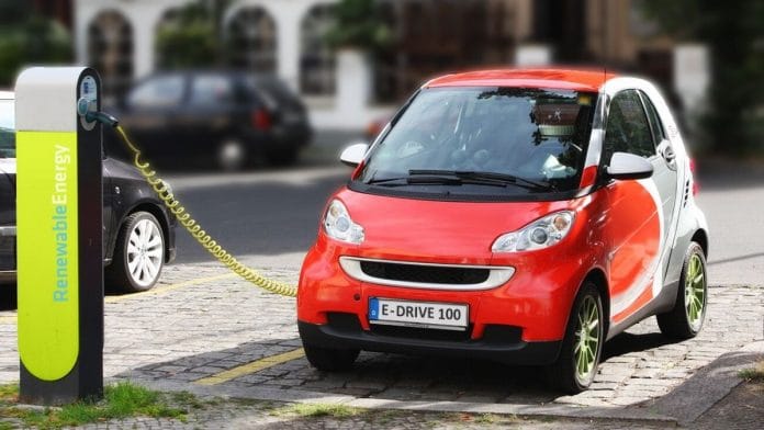 Electric car at a charging station | Wikimedia commons