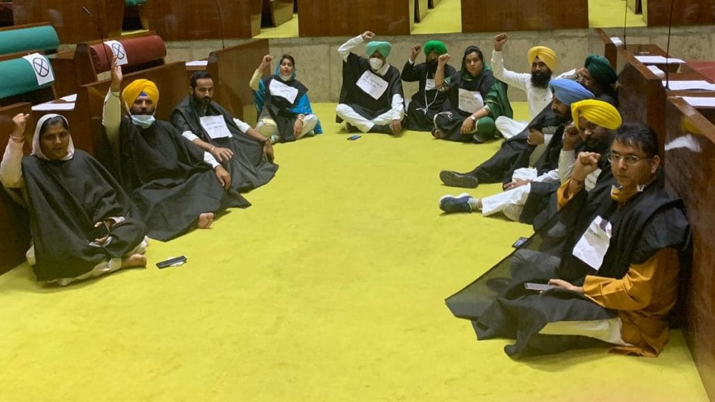AAP MLAs demonstrate on the floor of the Punjab assembly, demanding to see a copy of the legislation that Captain Amarinder Singh's govt plans to introduce Tuesday | By special arrangement