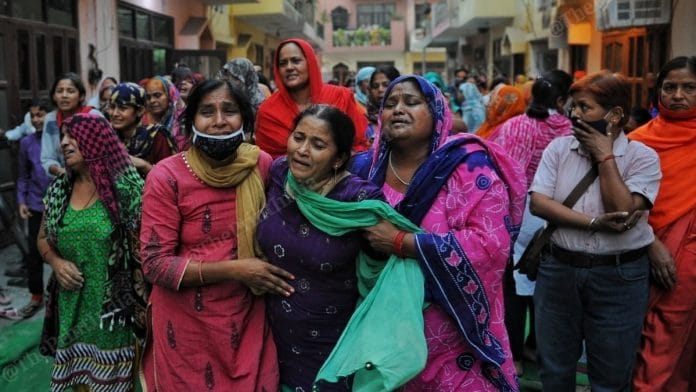 Family members of 21-year-old Nikita Tomar, who was shot dead, grieve her death in Ballabhgarh Tuesday. | Photo: Suraj Singh Bisht/ThePrint