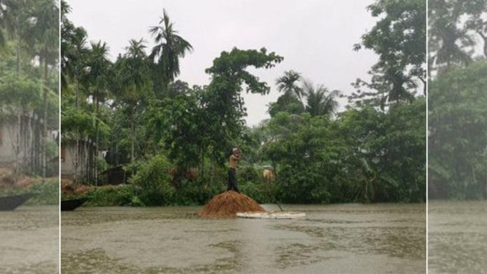 Representational image of farmers wading through waters to save their paddy crops during the flood season | Angana Chakrabarti | ThePrint