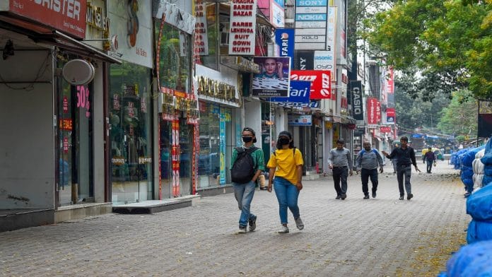 People walk through a closed Sarojini Nagar market, a popular haunt for college students | PTI