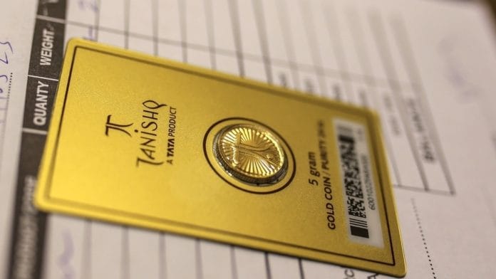 Representational image. | A five gram gold coin sits on a counter inside a Titan Co. Tanishq jewellery store in Mumbai. | Photo: Dhiraj Singh/Bloomberg