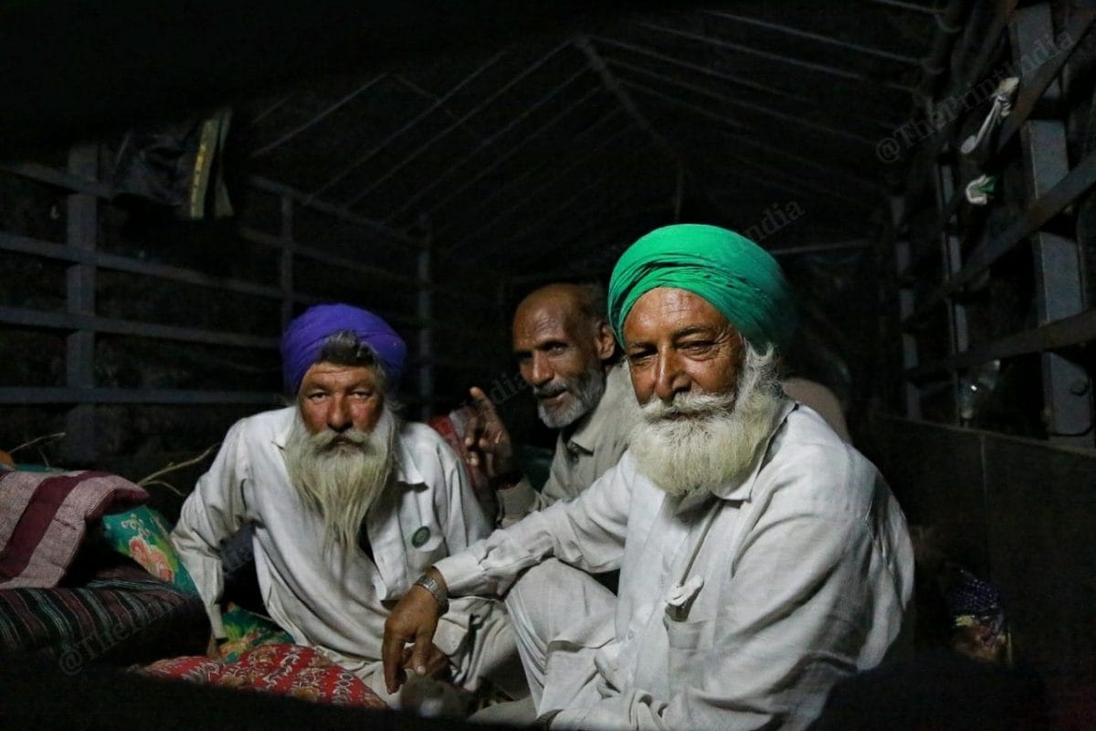 Farmers rest after dinner | Photo: Manisha Mondal | ThePrint