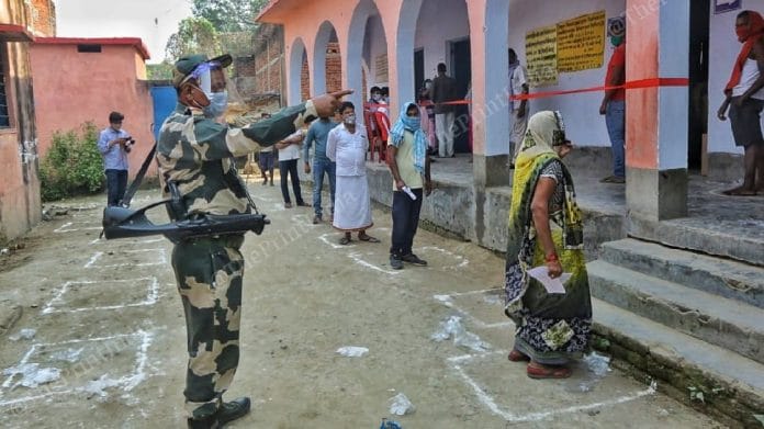 A BSF personnel at a polling booth in Folding Station Veterinary Ground | Praveen Jain | ThePrint