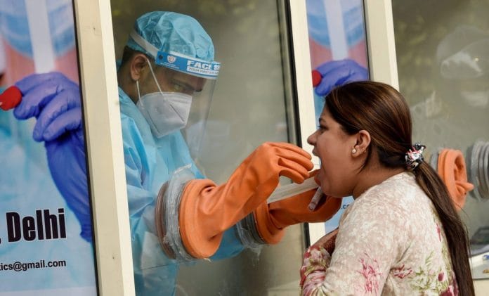Representational image | A health worker collects swab sample for Covid-19 test, at IIT Delhi in New Delhi | PTI/Kamal Kishore Nath