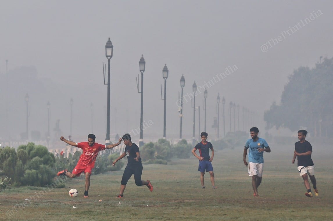 A few men seen playing football near the India Gate | Photo: Suraj Singh Bisht | ThePrint