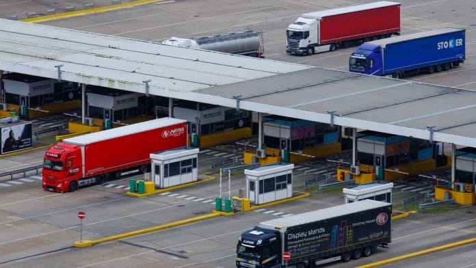 Freight lorries queue through a customs border control point at the Port of Dover Ltd. in Dover, UK | Luke MacGregor | Bloomberg