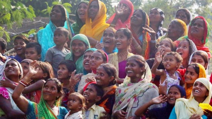 Women of villages look at the sky that saw many helicopters flying in Bihar election | Photo: Praveen Jain | ThePrint
