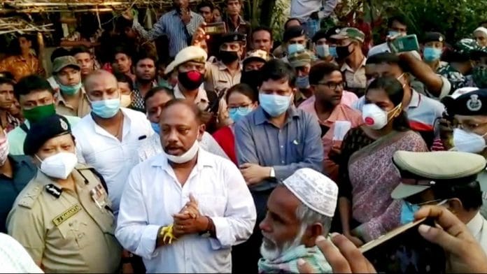 Assam Forest Minister Parimal Suklabaidya (front, second left) and top officials asking residents of Lailapur near the border with Mizoram to maintain peace | By special arrangement