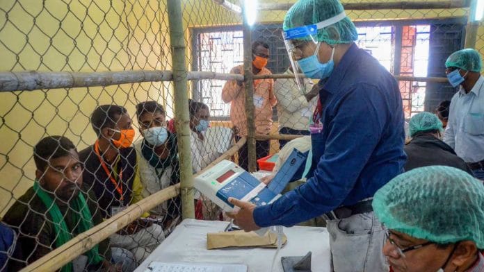 Election officials count votes at a centre on counting day of Bihar assembly polls, in Patna, on 10 November 2020. PTI