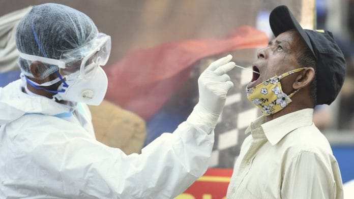 A man undergoes a Covid-19 test in New Delhi | PTI