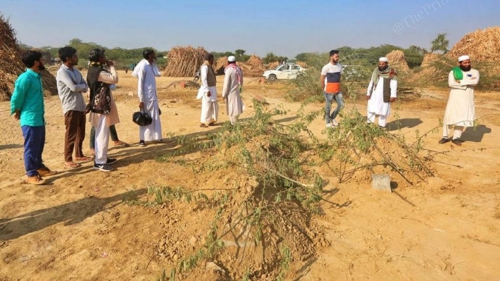 Relatives and locals at the graveyard where the four girls have been buried | Photo: Praveen Jain | ThePrint