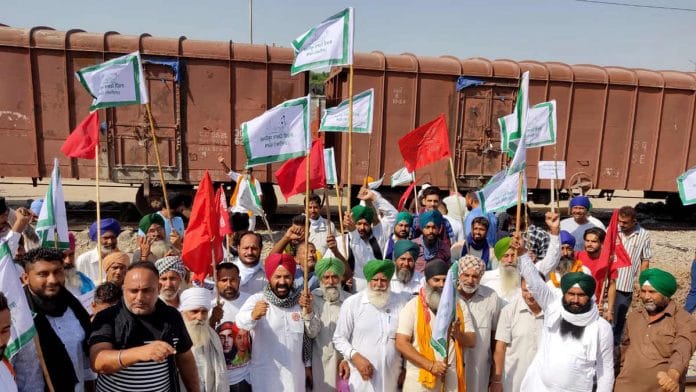Punjab farmers protesting against the Modi government's farm laws in front of a goods train at Phillaur railway station | File photo: ANI