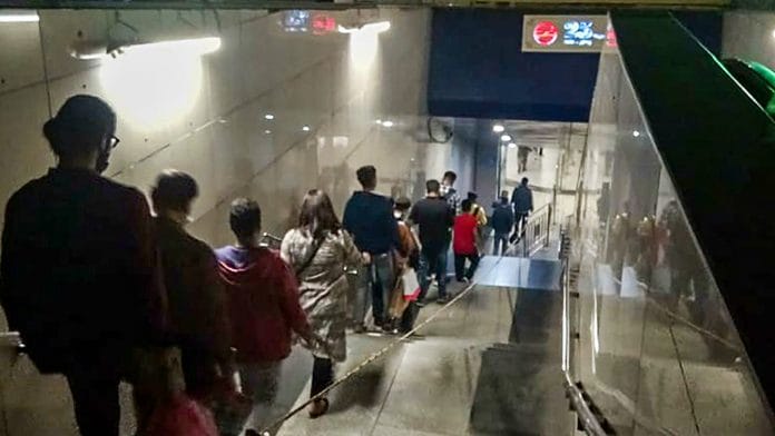 Passengers stand in a long queue at Rajiv Chowk Metro Station on 8 November | PTI Photo