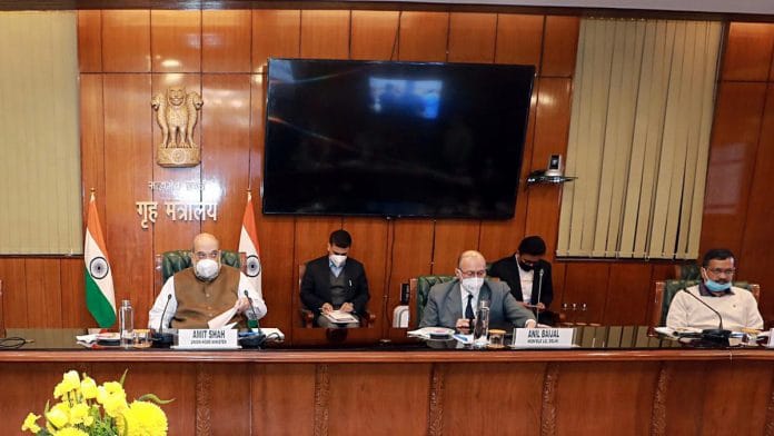 (From left) Union Home Minister Amit Shah, Delhi Lieutenant Governor Anil Baijal and CM Arvind Kejriwal attend a meeting on Covid-19 Sunday | Photo: ANI