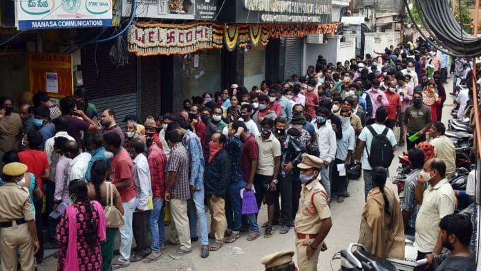 Flood-affected families queue up to apply at a MeeSeva centre in Khairtabad area in Hyderabad on 18 November 2020 | ANI