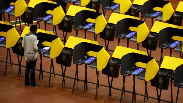 Voters cast ballots on electronic Voting Solutions for All People (VSAP) ballot marking machines at an early voting polling location at The Forum arena for the 2020 Presidential election in Inglewood, California, US, Oct. 29, 2020 | Patrick T. Fallon | Bloomberg