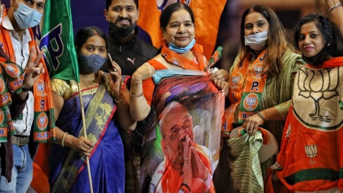 BJP workers celebrate the party’s victory in the Bihar assembly elections at the party HQs in New Delhi | Manisha Mondal | ThePrint