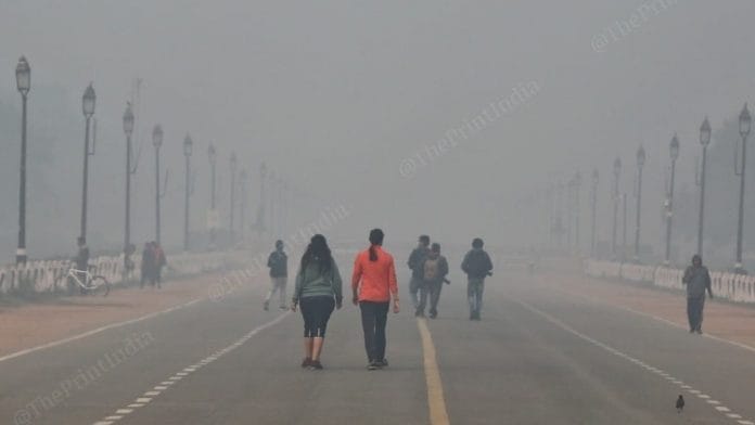 Joggers near India Gate amid rising air pollution in the national capital Sunday | Photo: Suraj Singh Bisht | ThePrint