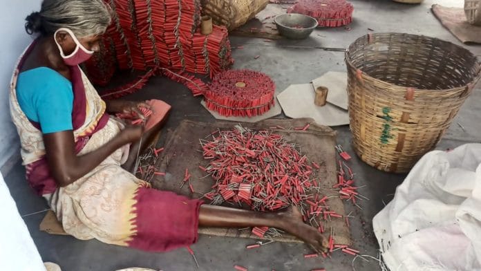 A woman makes crackers at a unit in Sivakasi, the firecracker manufacturing hub in the country | Photo: ANI