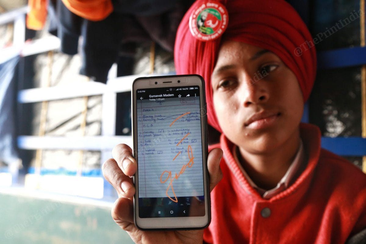 Gursewak Singh shows his card where he has been remakred good | Photo: Manisha 