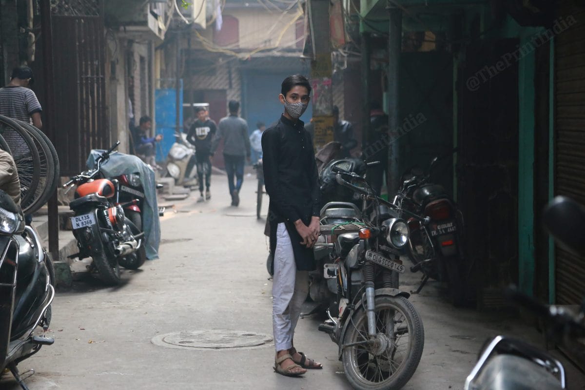 Faizan stands in the lane of his house | Photo: Manisha Mondal | ThePrint