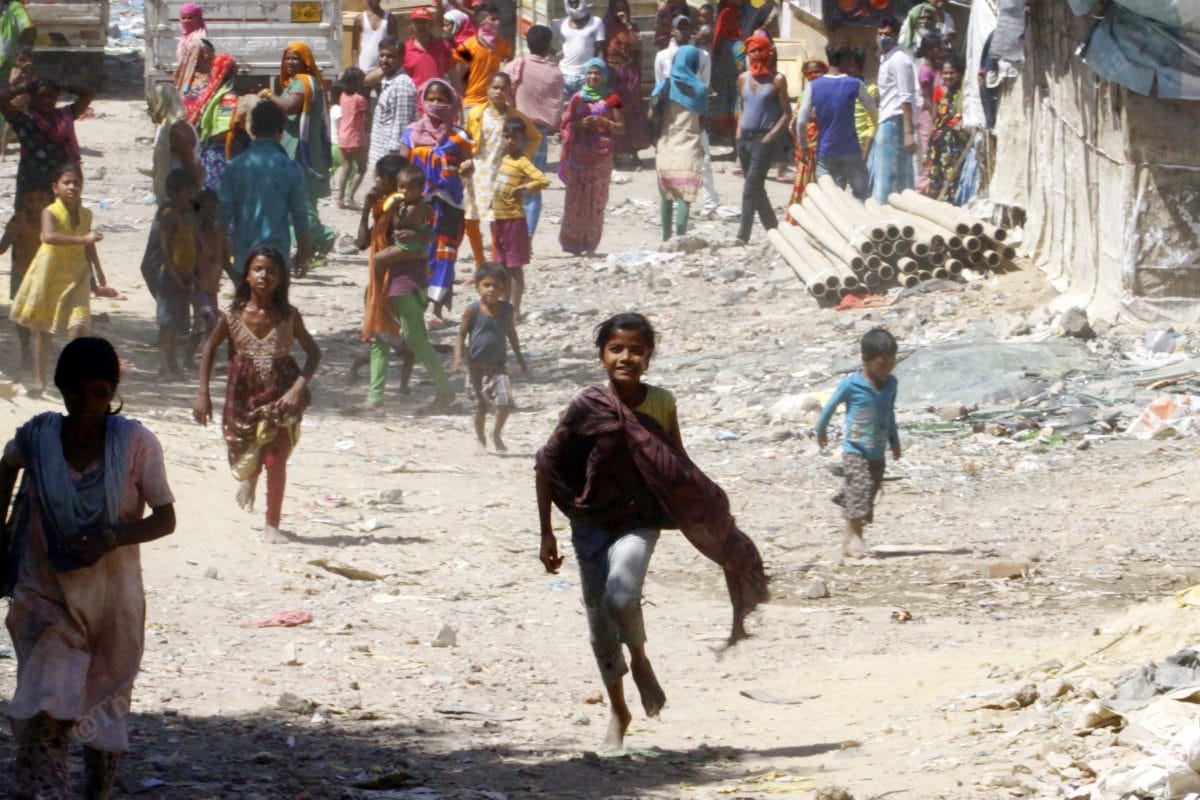 A kid runs towards the meal distribution centre in Uttar Pradesh | Photo: Praveen Jain | ThePrint 