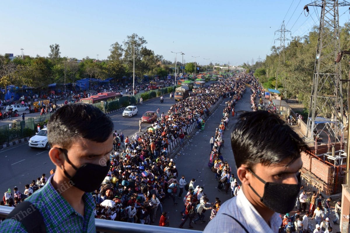 The migrants queueing up to board buses organised by the Delhi government at the Anand Vihar Bus Terminal, New Delhi. Photo: Suraj Singh Bisht | ThePrint