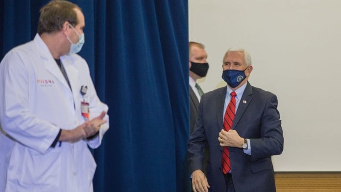 U.S. Vice President Mike Pence, center, arrives at a vaccine roundtable discussion in South Carolina, US, on Thursday, 10 Dec., 2020. | Bloomberg