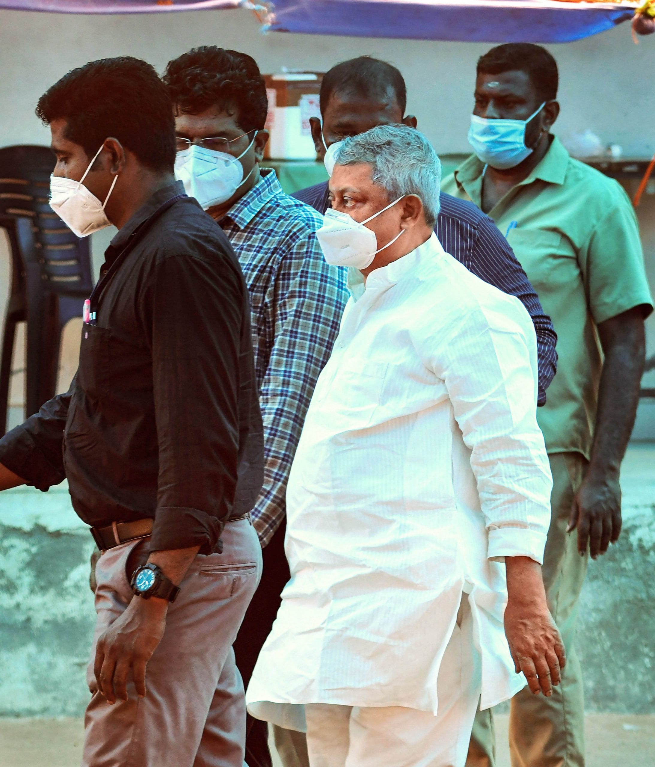 Father Thomas Kottoor (white shirt; centre) being taken to prison after his Covid-19 test, in Thiruvananthapuram on 22 December 2020 | PTI