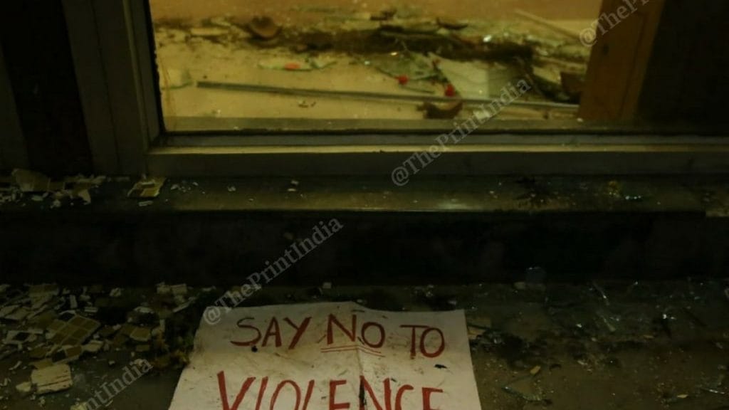 Glass lies shattered near the door to the Jamia Millia Islamia library after the police lathi-charged students in December 2019 | File photo: Manisha Mondal | ThePrint