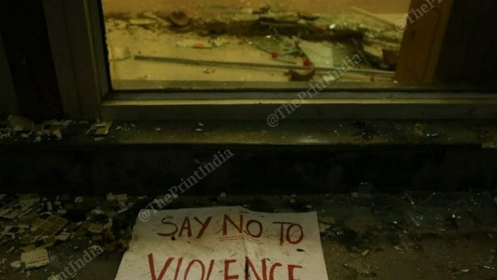Glass lies shattered near the door to the Jamia Millia Islamia library after the police lathi-charged students in December 2019 | File photo: Manisha Mondal | ThePrint