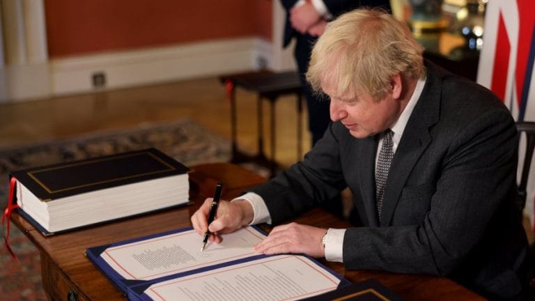 Boris Johnson signs Brexit deal after it passes through House of Commons