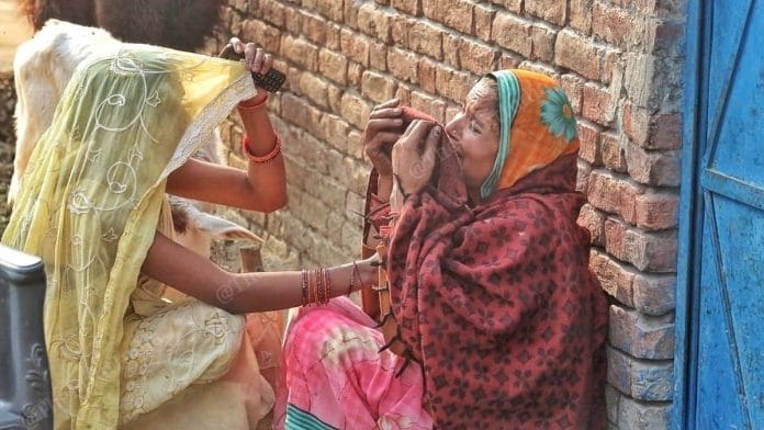 Nitu Shukla's mother Rekha, crying in the arms in front of her house at Makhi Beher village in Sitapur, Uttar Pradesh. | Photo: Praveen Jain/ThePrint