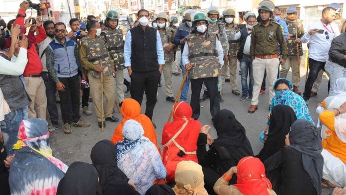 District administration officials and police in Begumbagh area, where the stone-pelting took place Friday, in Ujjain, Madhya Pradesh | By special arrangement