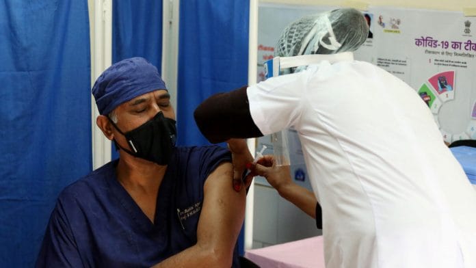 Representational image of a doctor being vaccinated for Covid-19 in Ajmer | Photo: ANI